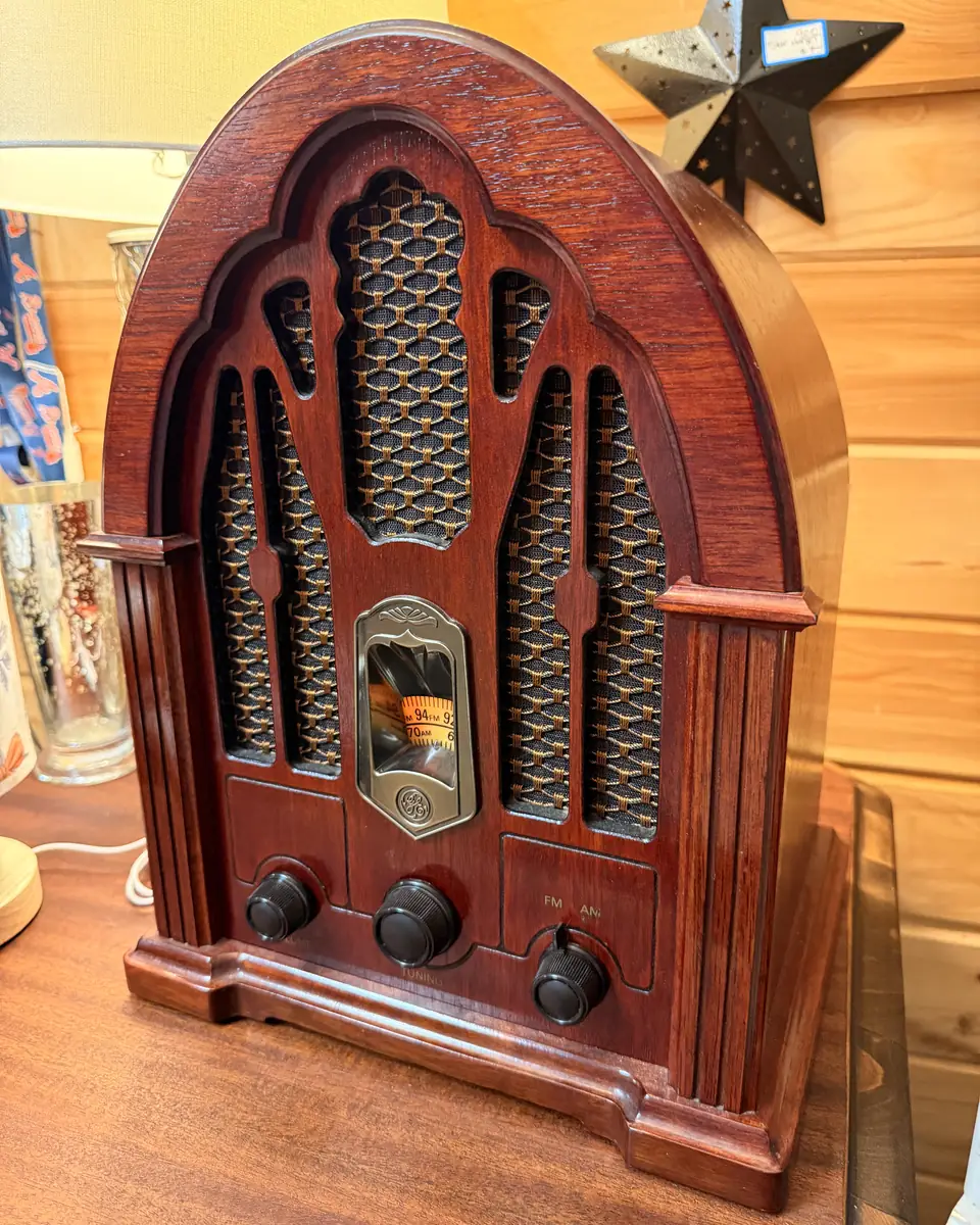 Cathedral-style tabletop radio with arched cabinet and patterned grille at Vintage 72
