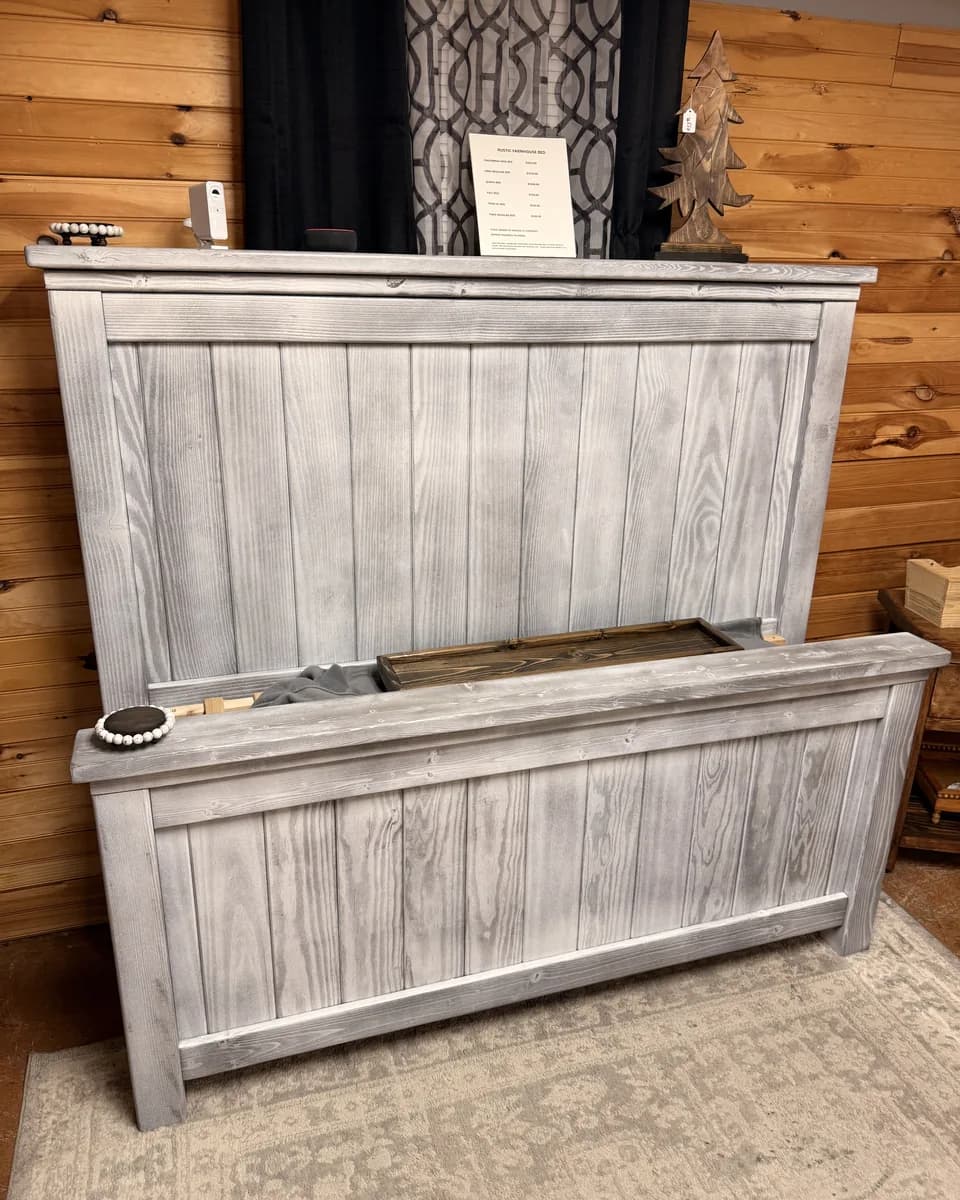 Custom-built gray wood farmhouse headboard and footboard displayed downstairs at Vintage 72