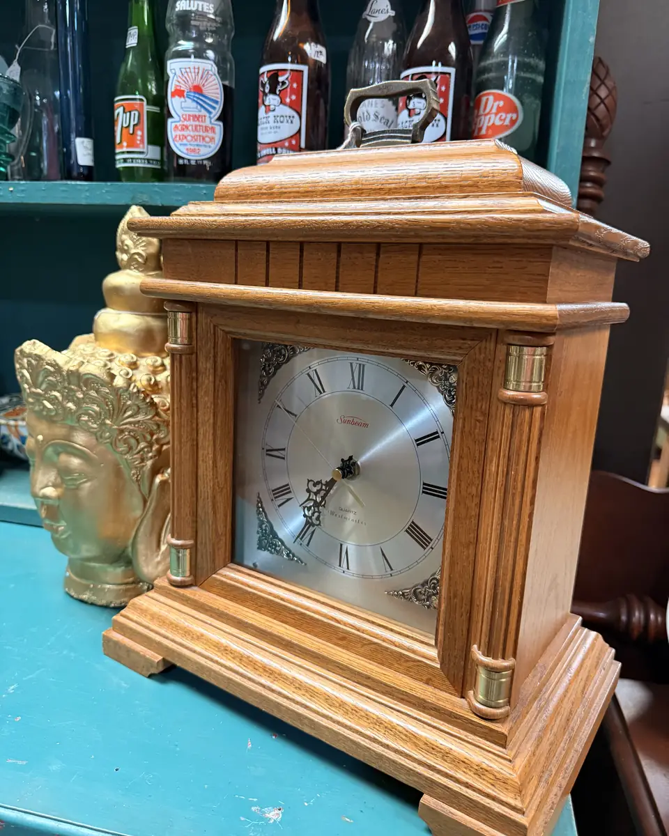 Sunbeam mantel clock with handled case and Roman-numeral face at Vintage 72