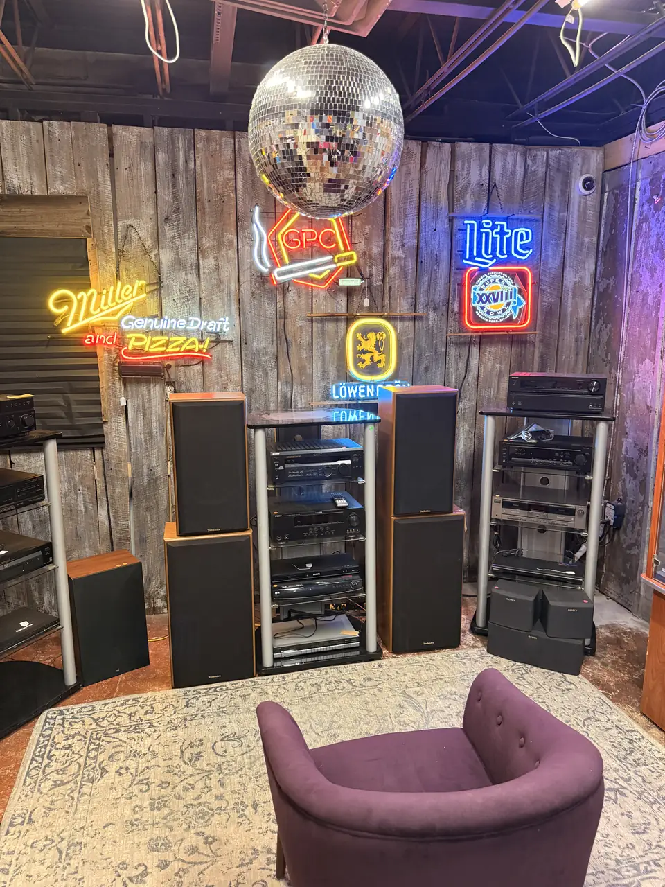 House of Sound room filled with records, stereo equipment, and glowing signs