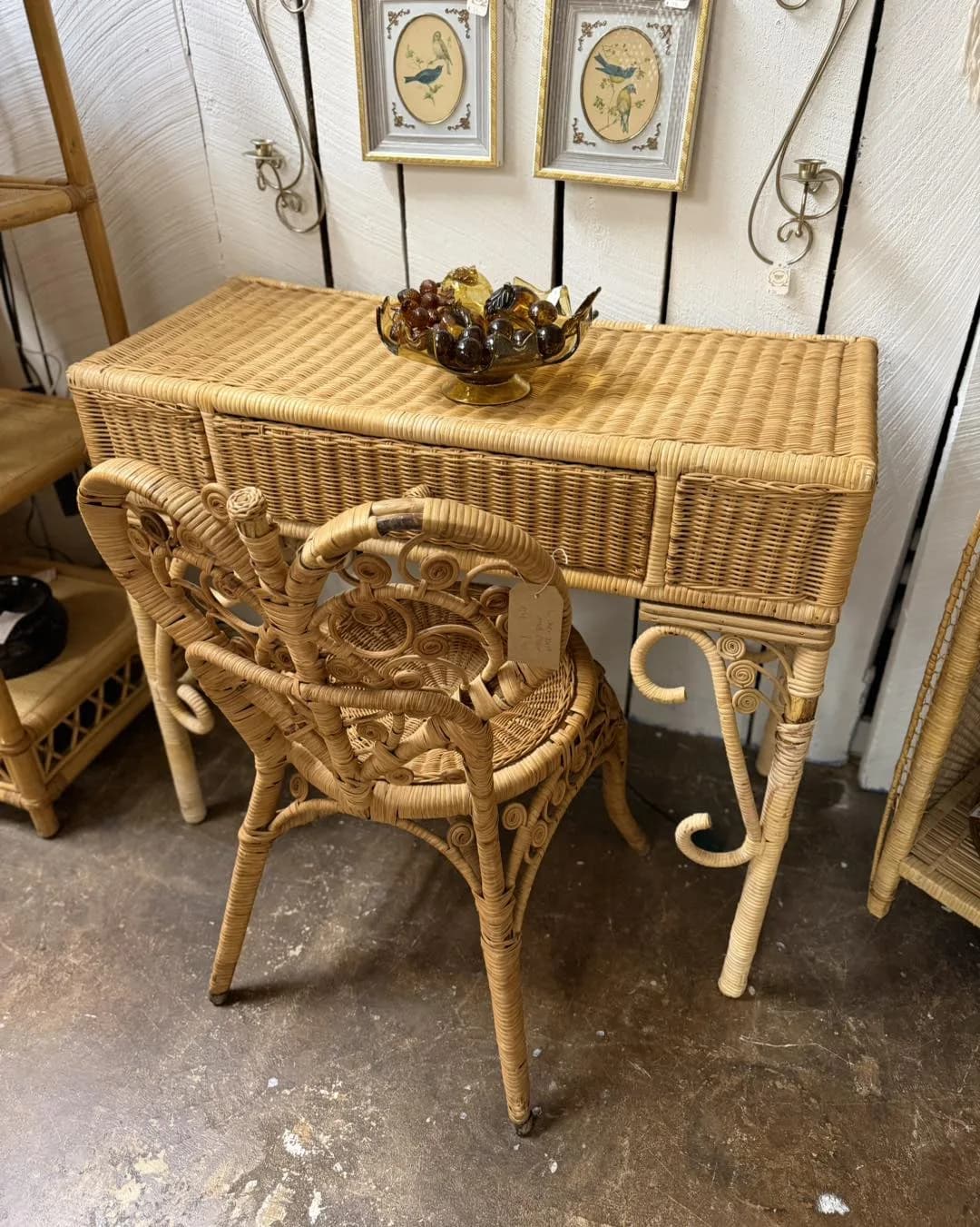 Wicker desk and chair set in a vintage furniture booth