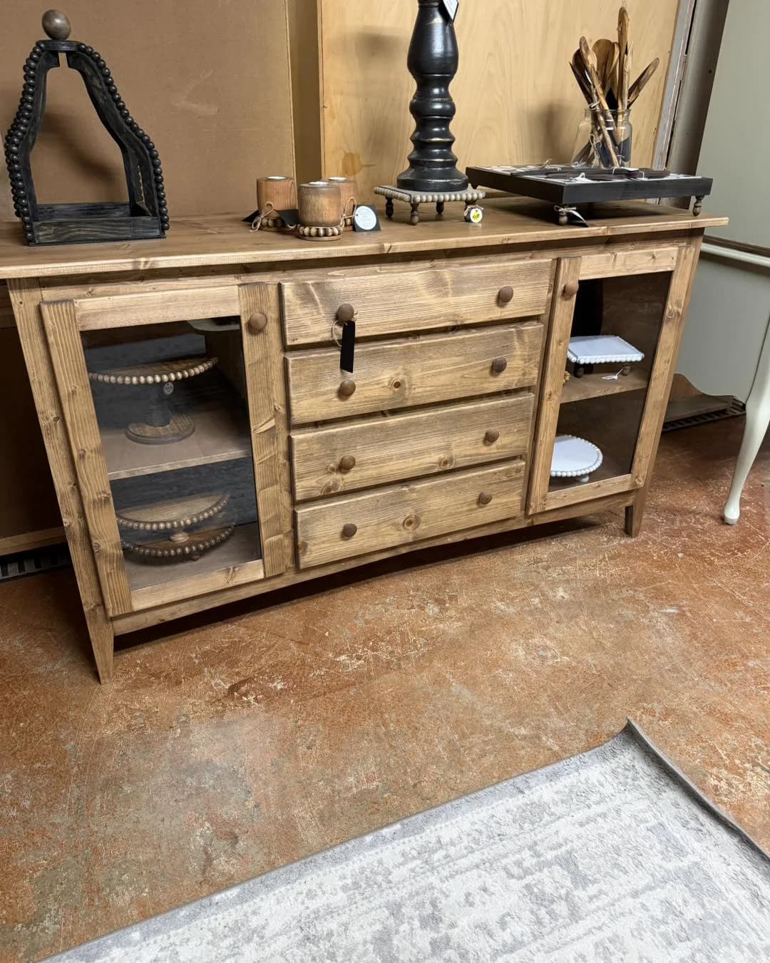 Wood sideboard on display in a Vintage 72 furniture vendor booth