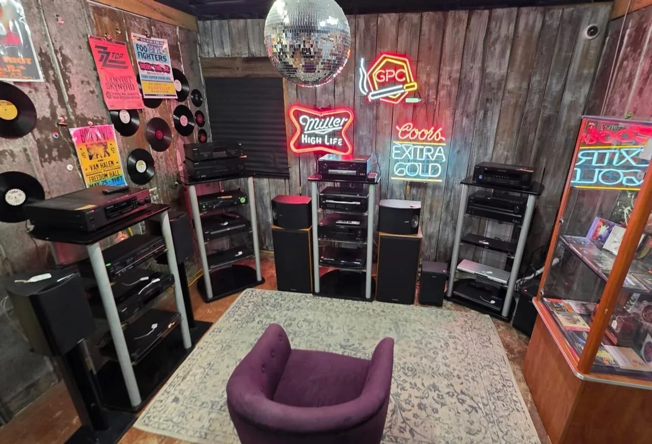 House of Sound booth with vintage stereo equipment, records, and neon signs