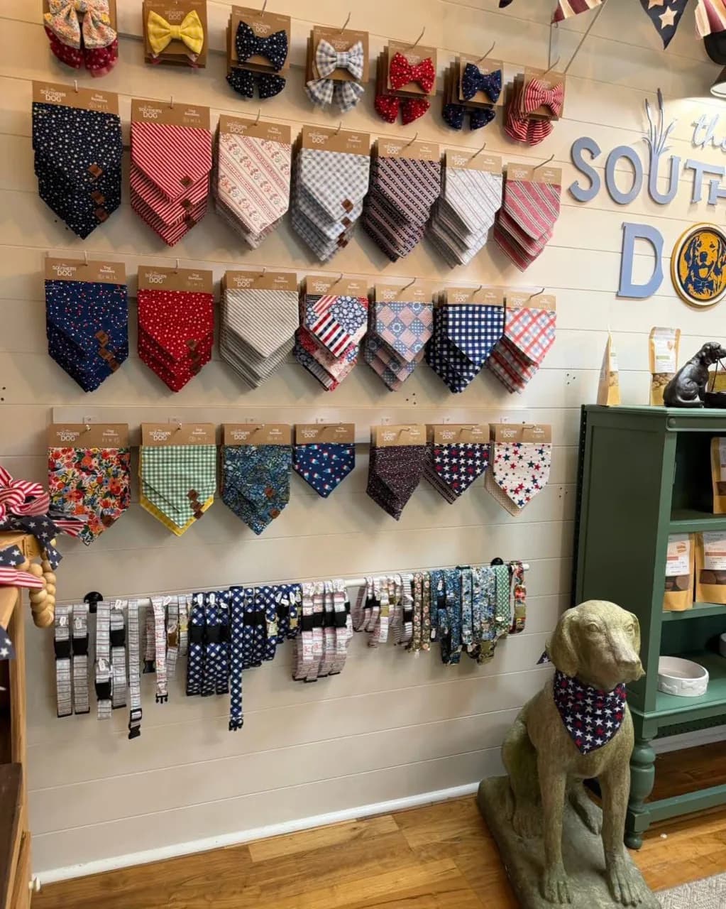 Colorful dog bandanas, bow ties, and collars in the Southern Dog pet boutique