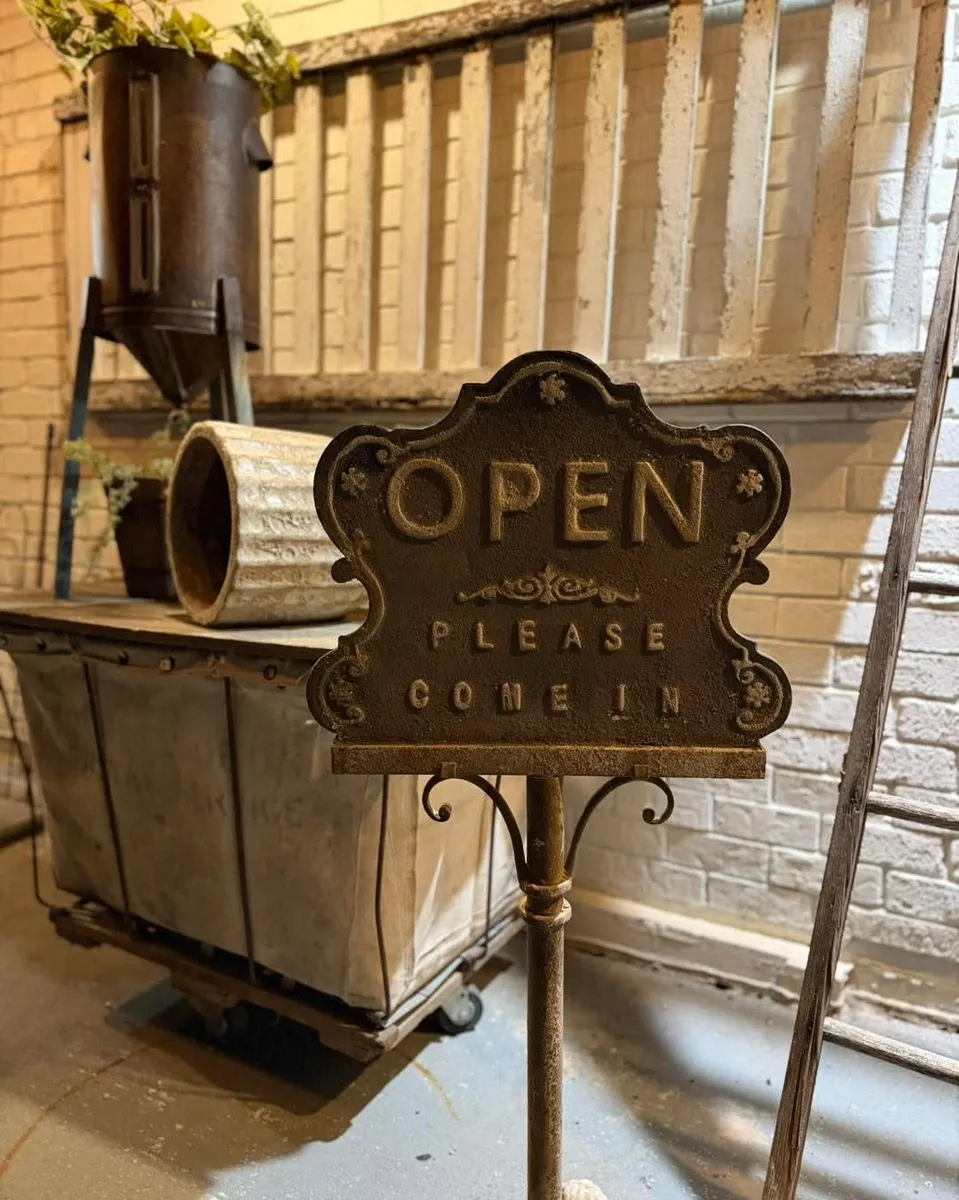 Vintage 72 freestanding open welcome sign at the front of the store