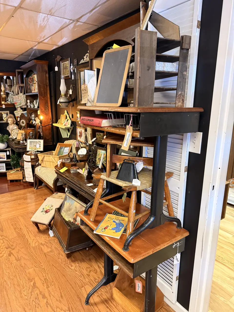 Two old school desks with wood seats and writing surfaces at Vintage 72